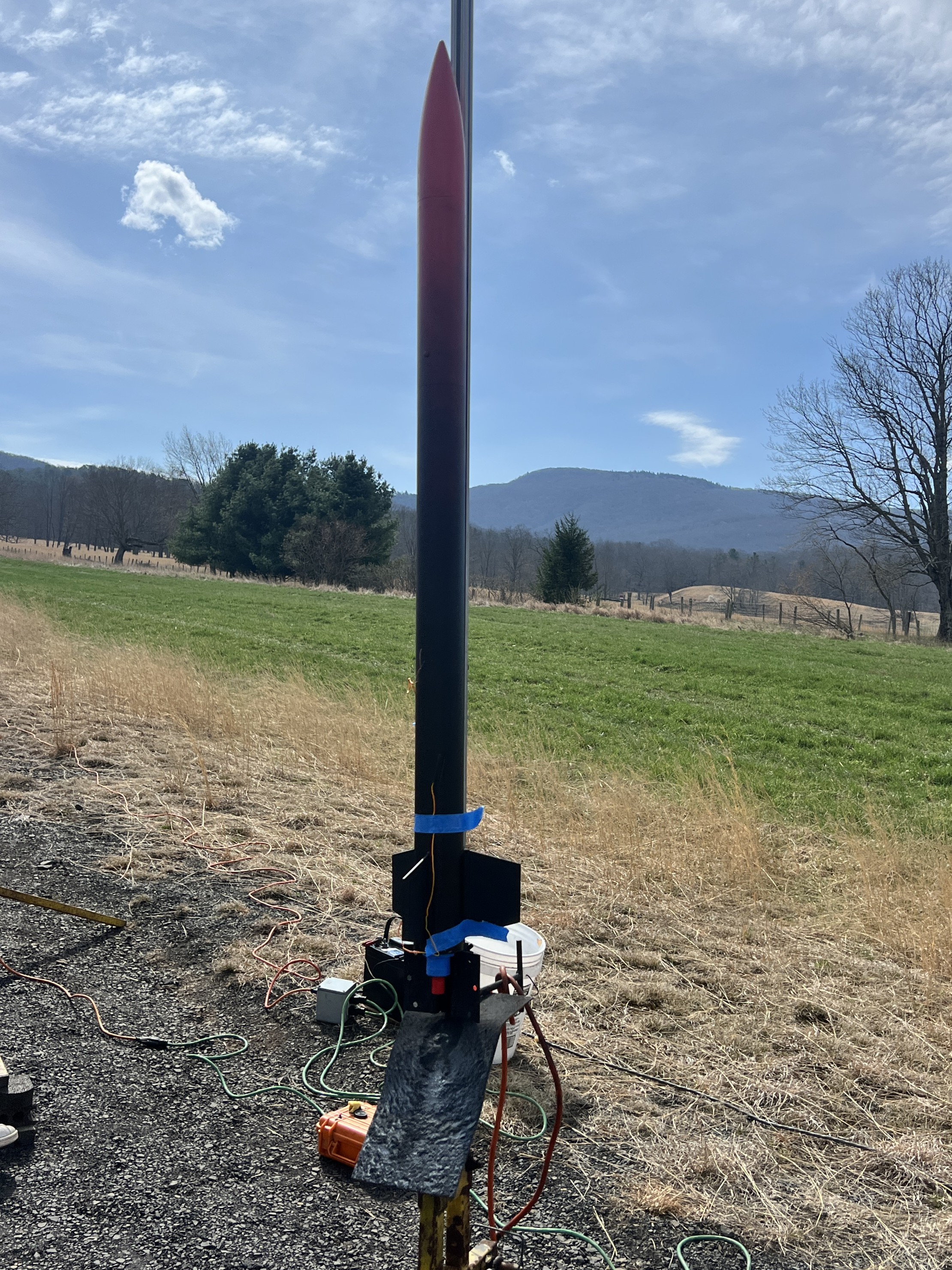 Rocket mounted on launch rail with ignition wires